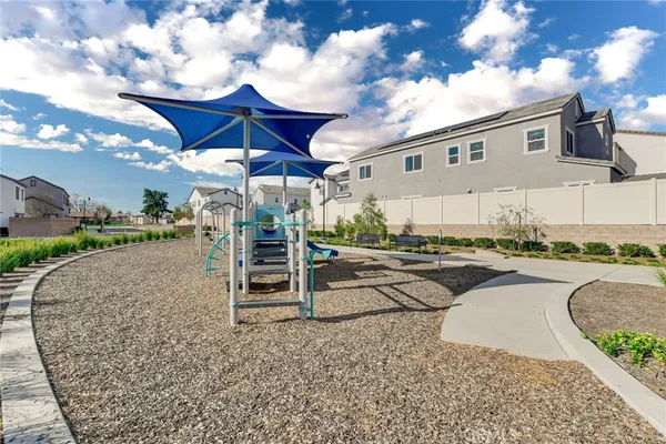 a view of a big yard with table and chairs