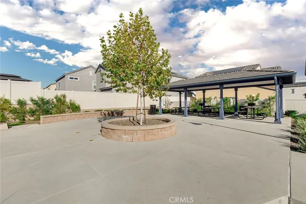 a view of a backyard with sitting area