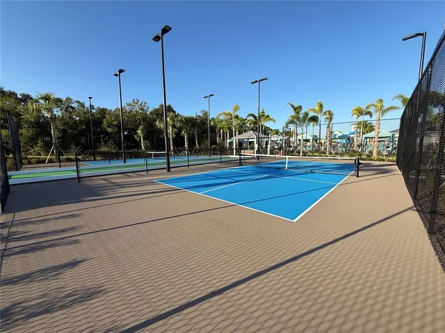 a view of a lake with a table and chairs