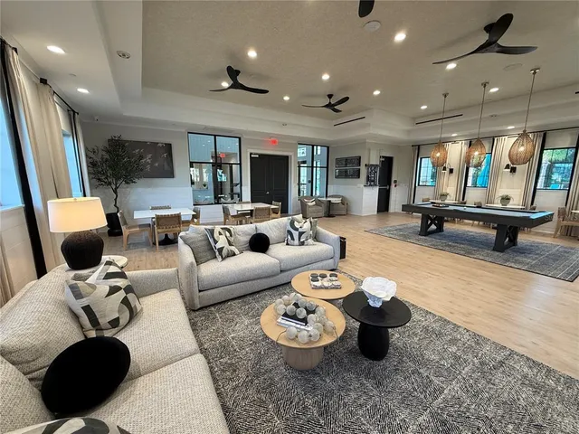 a view of a lake with couches chairs