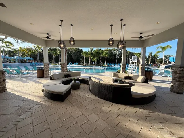 a view of a lake with palm trees