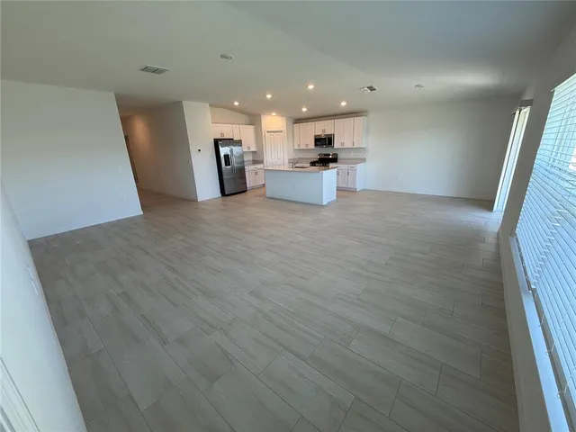 a bathroom with a double vanity sink and mirror