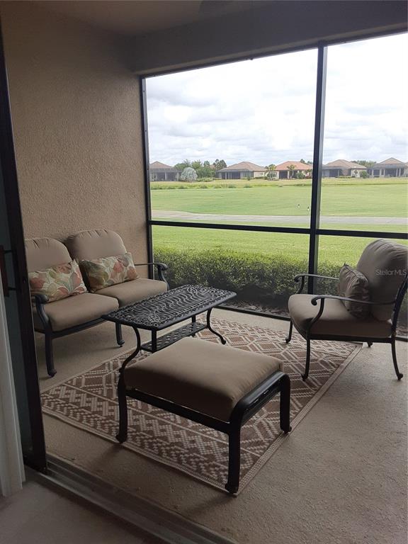13605 Messina Loop, Unit 104 Bradenton, FL 34211 - Photo 13 of 38 a outdoor sitting area with furniture and garden