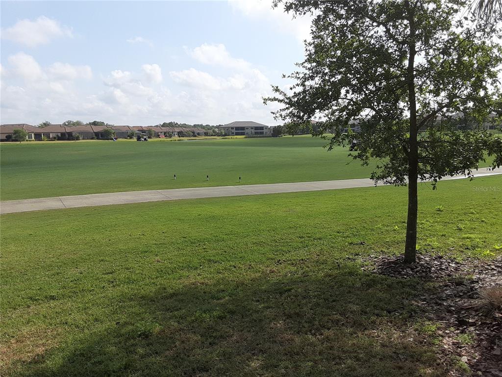 13605 Messina Loop, Unit 104 Bradenton, FL 34211 - Photo 16 of 38 a view of a field with an ocean