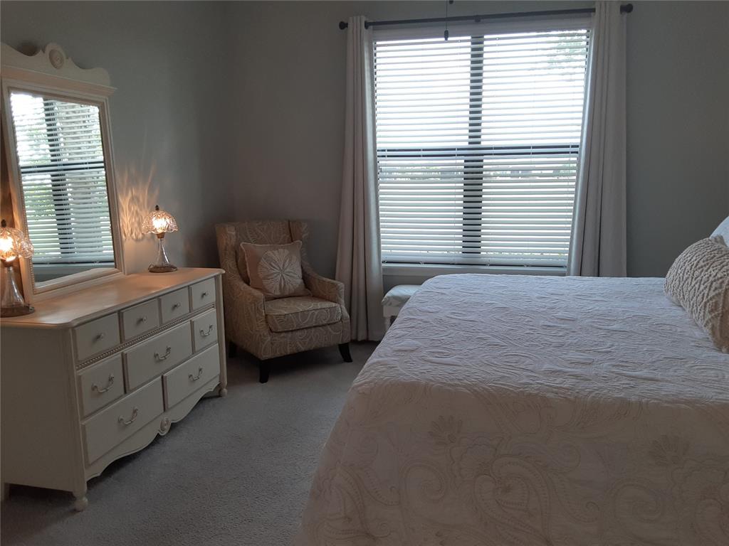 13605 Messina Loop, Unit 104 Bradenton, FL 34211 - Photo 19 of 38 a spacious bedroom with a bed and a window