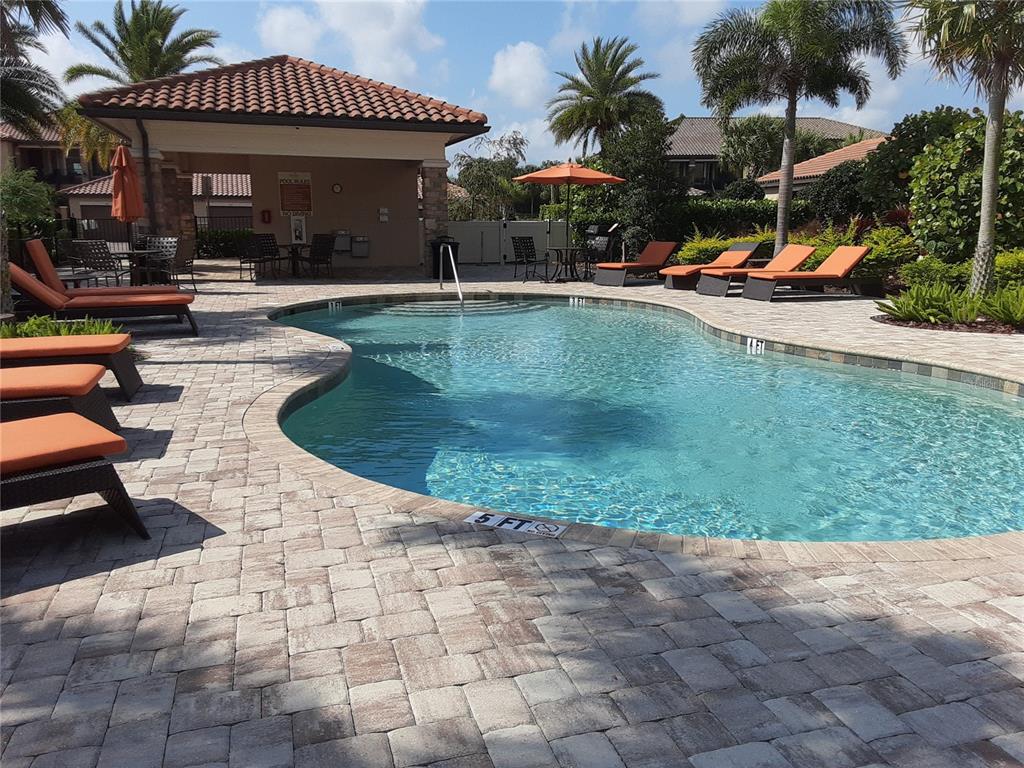 13605 Messina Loop, Unit 104 Bradenton, FL 34211 - Photo 26 of 38 a view of a house with swimming pool and sitting area