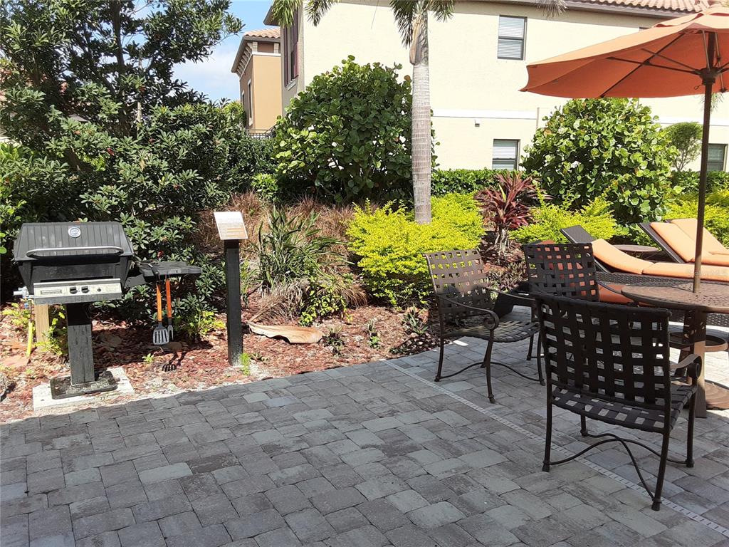 13605 Messina Loop, Unit 104 Bradenton, FL 34211 - Photo 27 of 38 a view of a chairs and tables in the patio