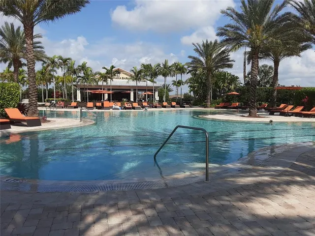 a view of swimming pool with outdoor seating