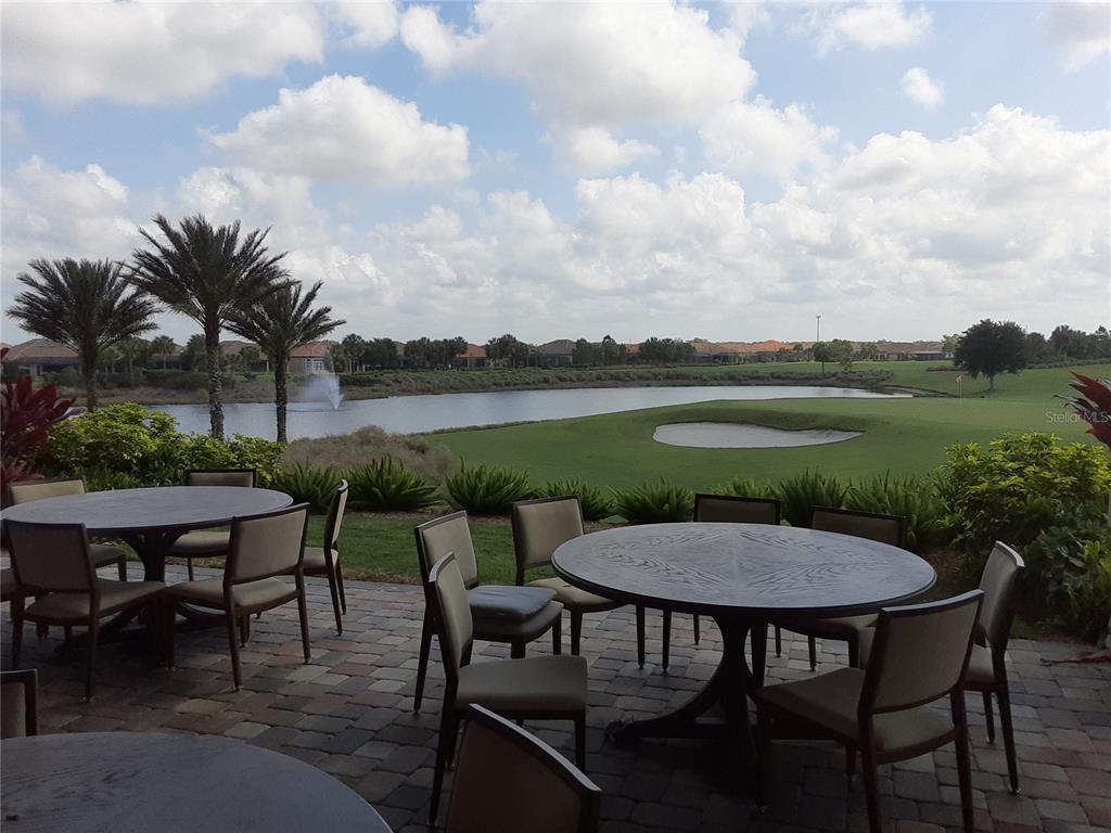 13605 Messina Loop, Unit 104 Bradenton, FL 34211 - Photo 37 of 38 a view of a chairs and table in patio
