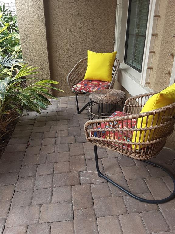 13605 Messina Loop, Unit 104 Bradenton, FL 34211 - Photo 4 of 38 a outdoor space with lots of white furniture