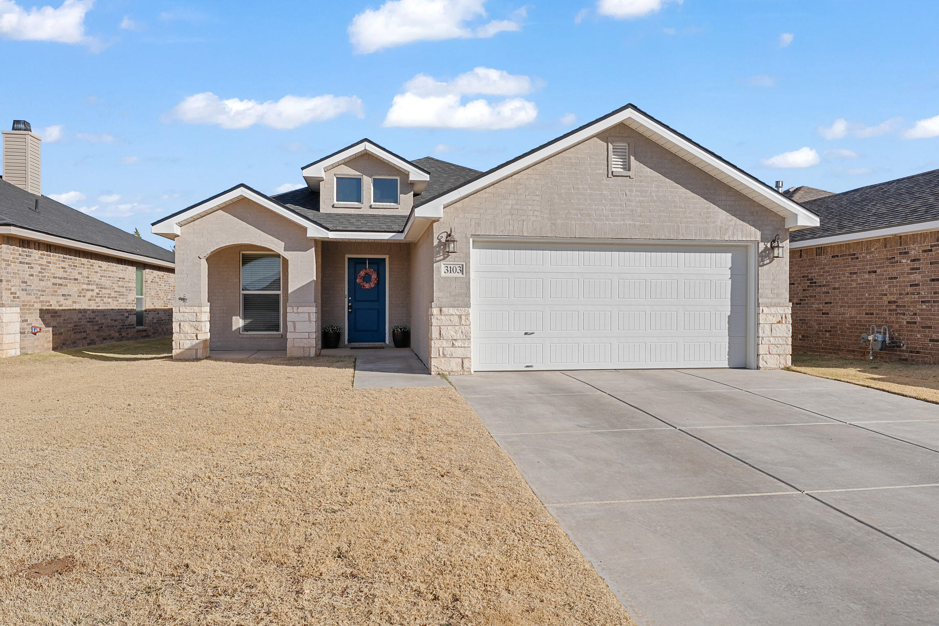 3103 Urbana Avenue Lubbock, TX 79407 - Photo 1 of 19 front view of a house with a yard and garage