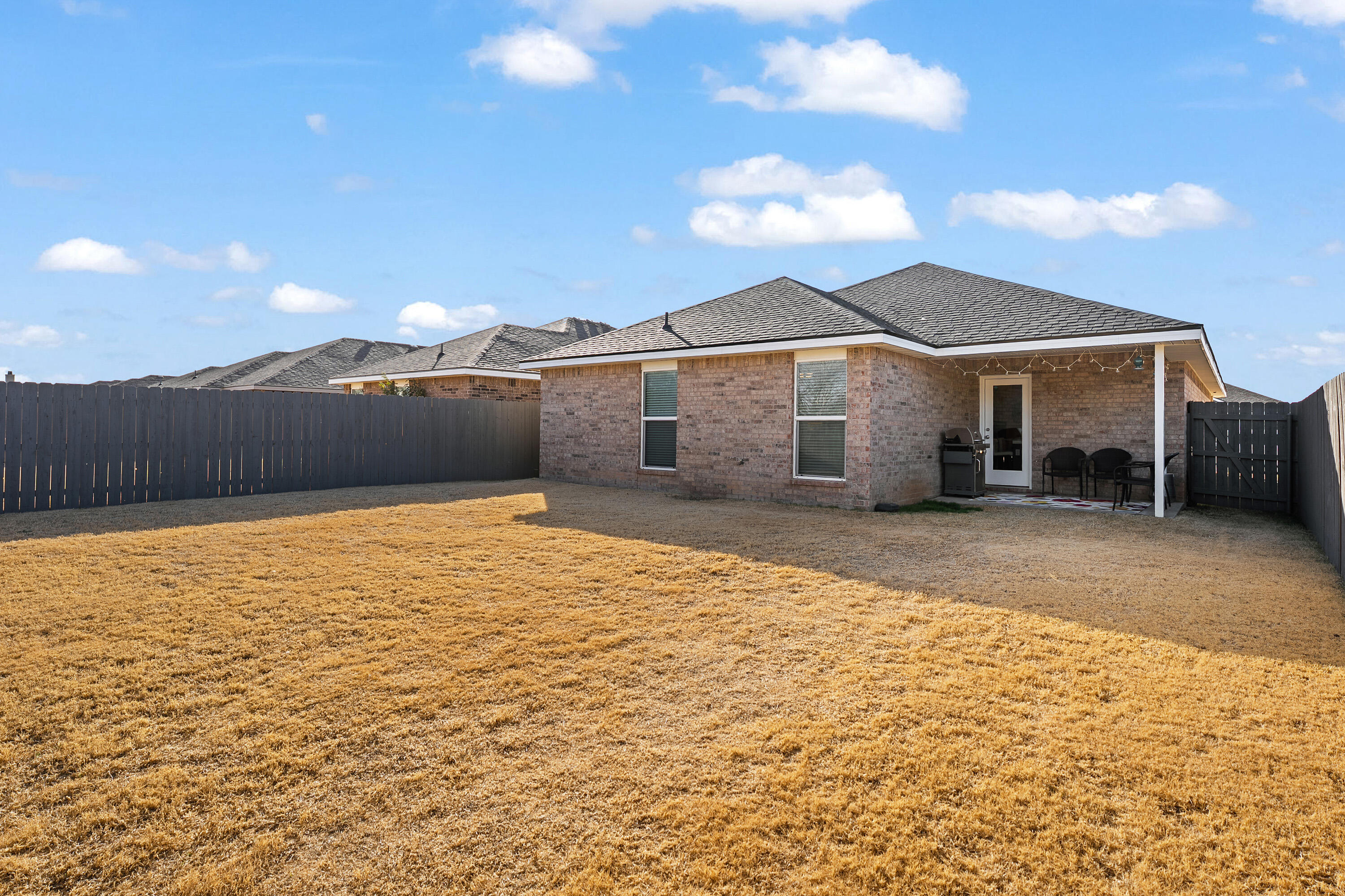 3103 Urbana Avenue Lubbock, TX 79407 - Photo 18 of 19 a front view of a house with a yard