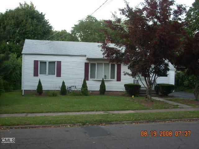 12 Twin Brook Road Hamden, CT 06514 - Photo 1 of 1 a front view of a house with a garden