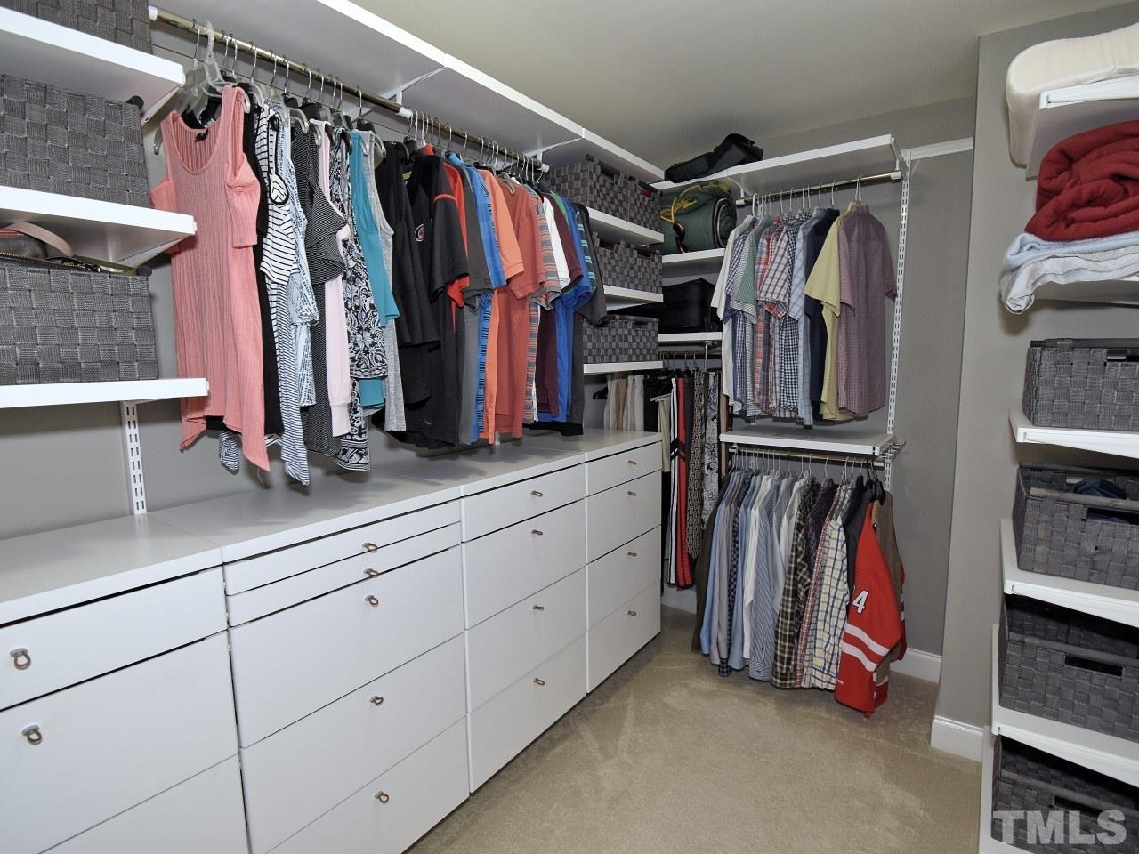 112 Poppy Hills Court Raleigh, NC 27603 - Photo 25 of 42 a view of walk in closet with clothes and shoes