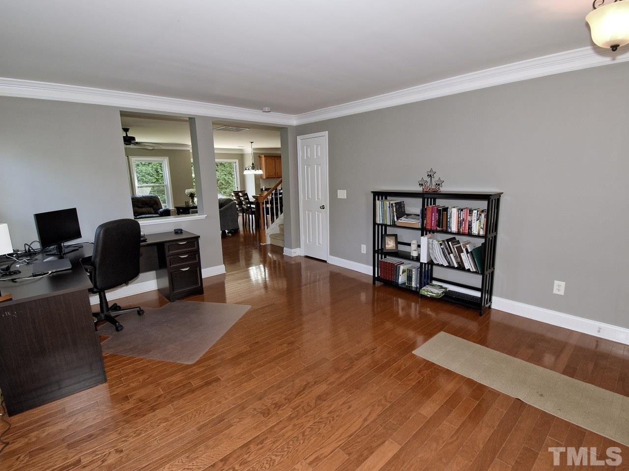 112 Poppy Hills Court Raleigh, NC 27603 - Photo 6 of 42 a view of a livingroom with workspace and a window