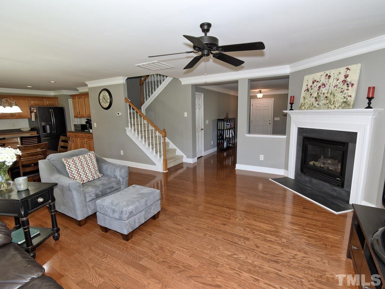 112 Poppy Hills Court Raleigh, NC 27603 - Photo 8 of 42 a living room with furniture and a fireplace