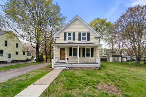 a front view of a house with a yard