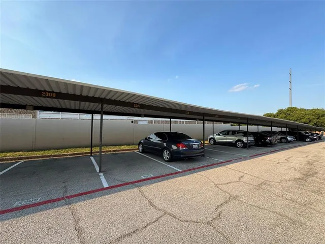 outdoor view of parking with cars parked