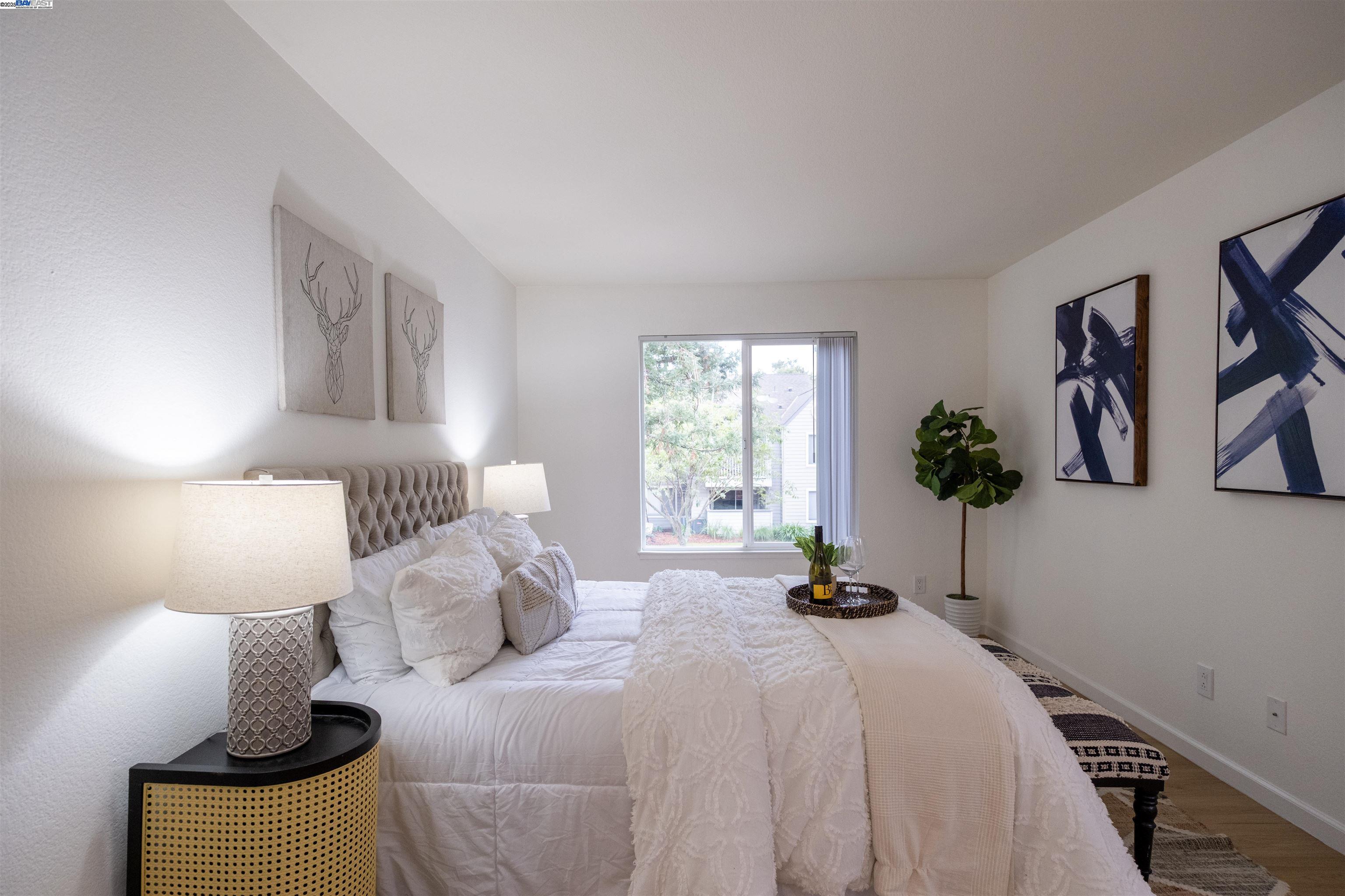 285 Reflections Drive, Unit 23 San Ramon, CA 94583 - Photo 18 of 33 a bedroom with a bed and painting on the wall