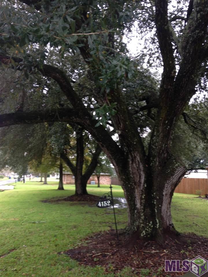 4152 Foret Street Addis, LA 70710 - Photo 3 of 14 front old oak trees
