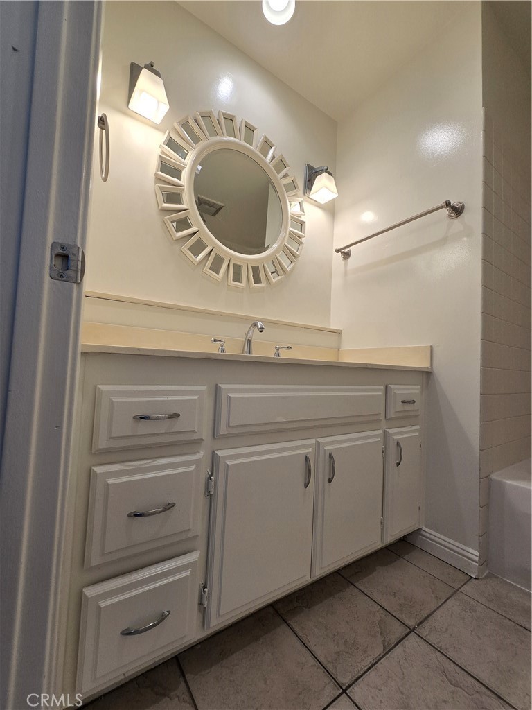 783 Grayling Costa Mesa, CA 92626 - Photo 9 of 25 a bathroom with a sink and a mirror