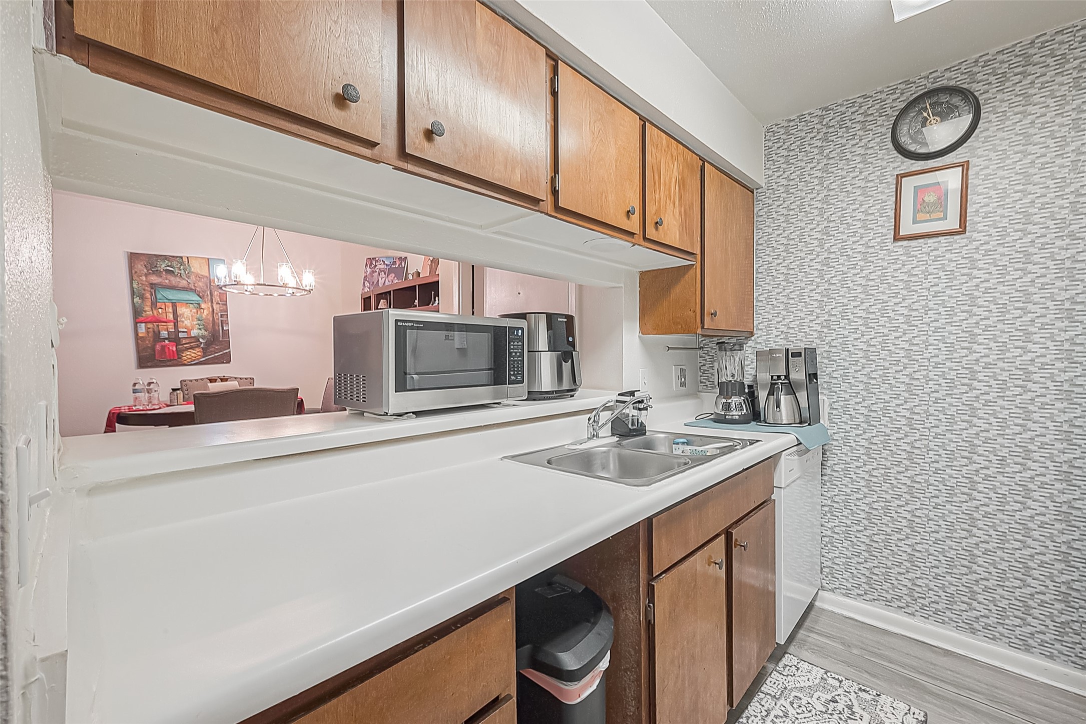 3075 Walnut Bend Lane, Unit 28 Houston, TX 77042 - Photo 10 of 19 a kitchen with stainless steel appliances a sink and cabinets