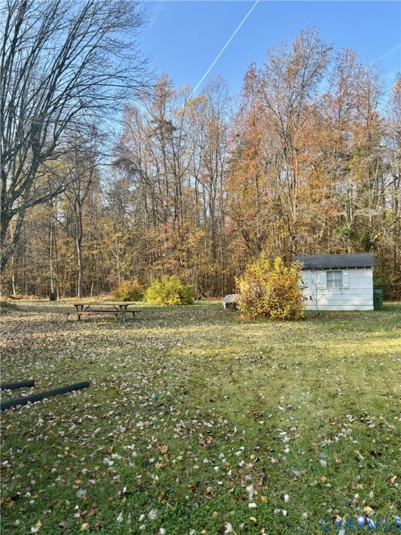 3485 Jefferson Landing Road Powhatan, VA 23139 - Photo 4 of 15 View of green lawn with an outbuilding
