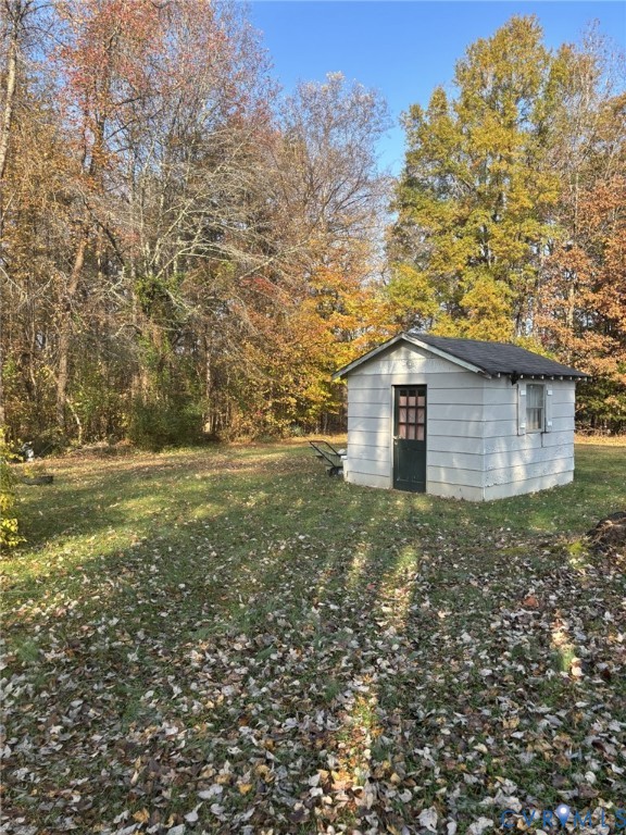 3485 Jefferson Landing Road Powhatan, VA 23139 - Photo 5 of 15 View of grassy yard with an outdoor structure