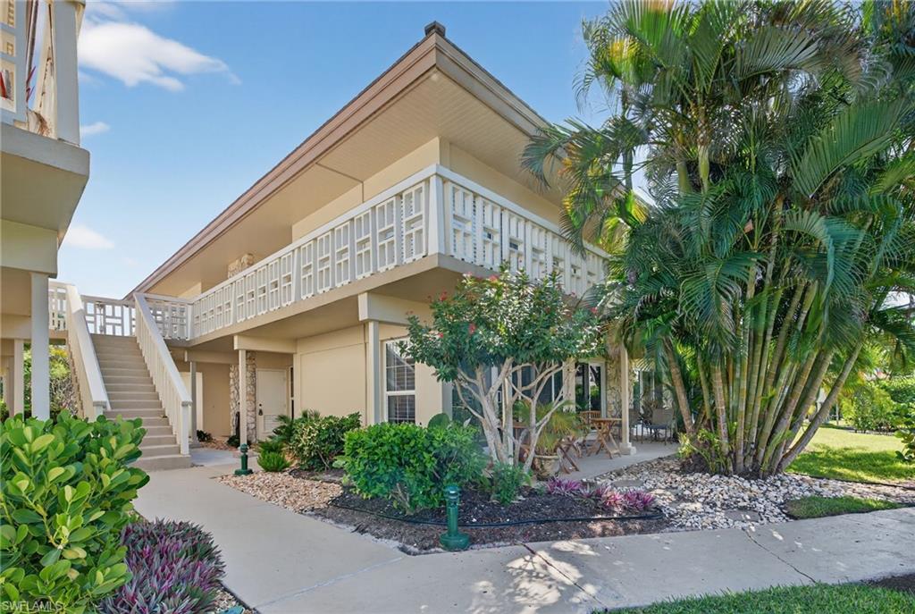 1215 Edington Place, Unit A2 Marco Island, FL 34145 - Photo 28 of 29 a view of a house with a tree