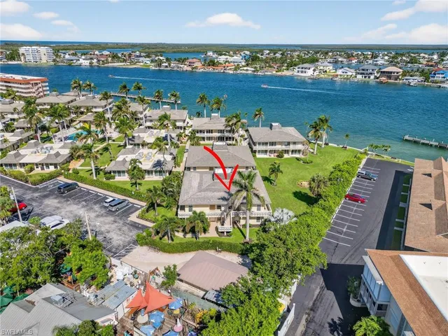 an aerial view of a house with a ocean view