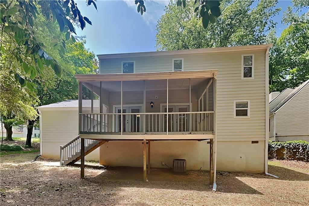 335 Olde Bridge Way Johns Creek, GA 30022 - Photo 17 of 19 a view of a house with a deck and a chair