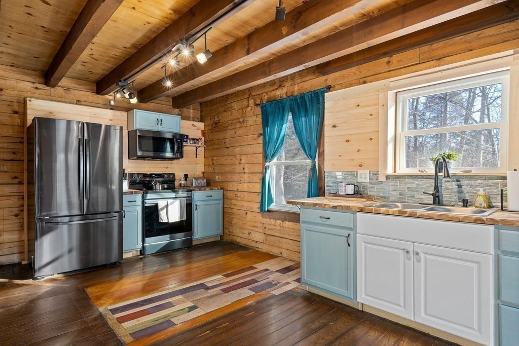 71 NW Road Westhampton, MA 01027 - Photo 7 of 41 a kitchen with stainless steel appliances a stove sink and refrigerator