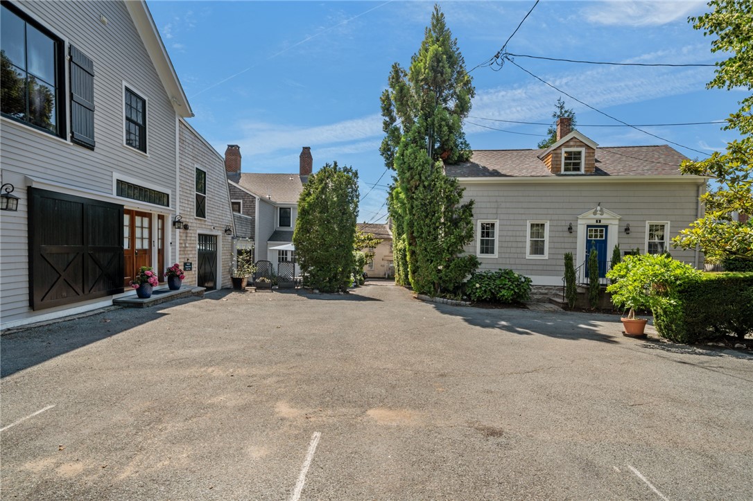 352 Spring Street Newport, RI 02840 - Photo 27 of 50 Looking west from parking lot towards driveway.