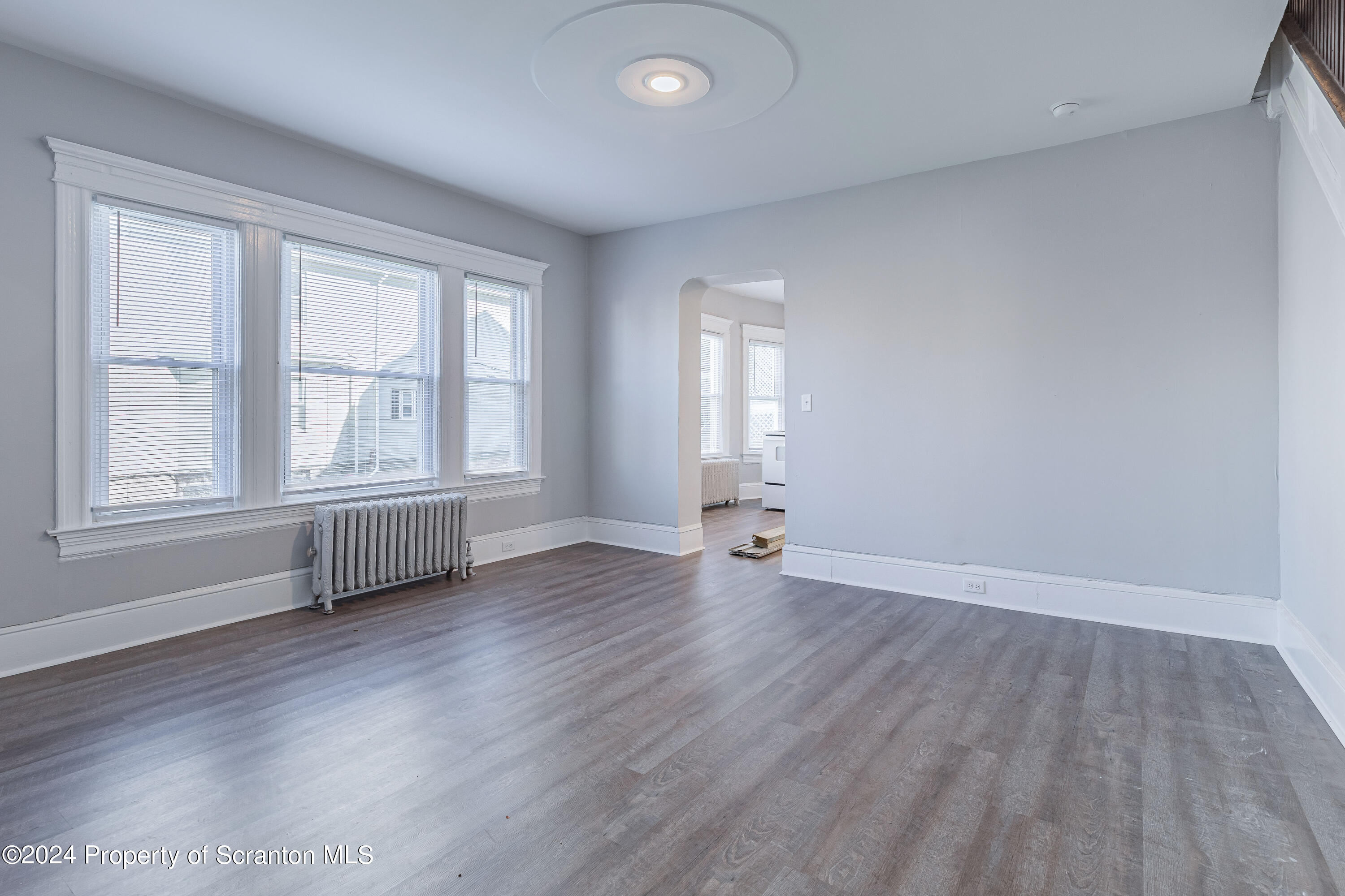 800 Quincy Avenue Scranton, PA 18510 - Photo 22 of 23 an empty room with wooden floor and windows