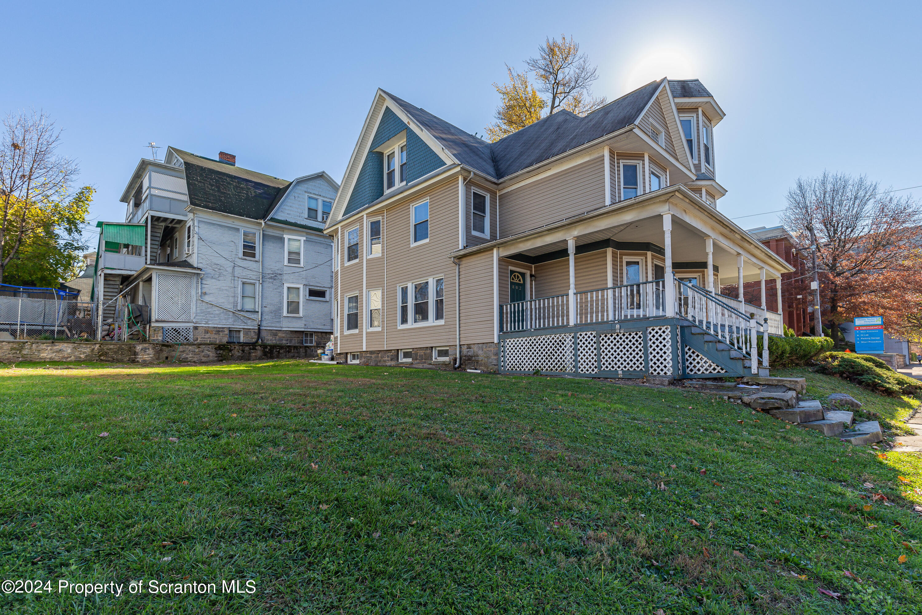 800 Quincy Avenue Scranton, PA 18510 - Photo 7 of 23 a view of a big house with a big yard and large trees