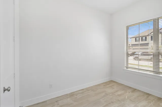 a view of an empty room with a window