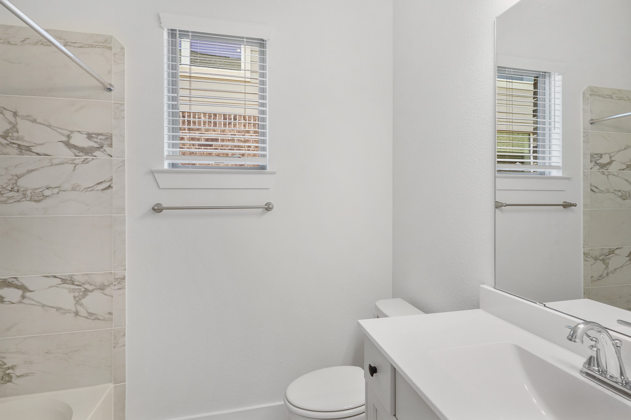 515 Tawny Rim Drive Willis, TX 77318 - Photo 8 of 22 a bathroom with a sink toilet and window