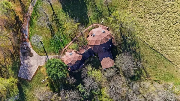 a backyard of a house with lots of green space