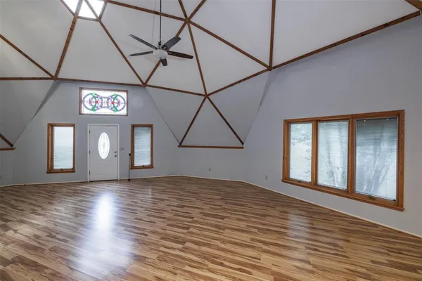 a view of kitchen with kitchen island stainless steel appliances sink stove and cabinets