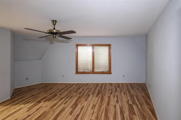 a bathroom with a shower and a sink