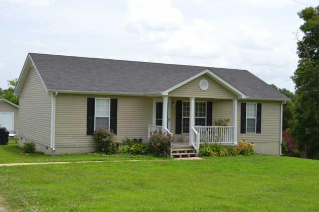 2580 Black Road Prospect, TN 38477 - Photo 1 of 7 a front view of a house with a garden