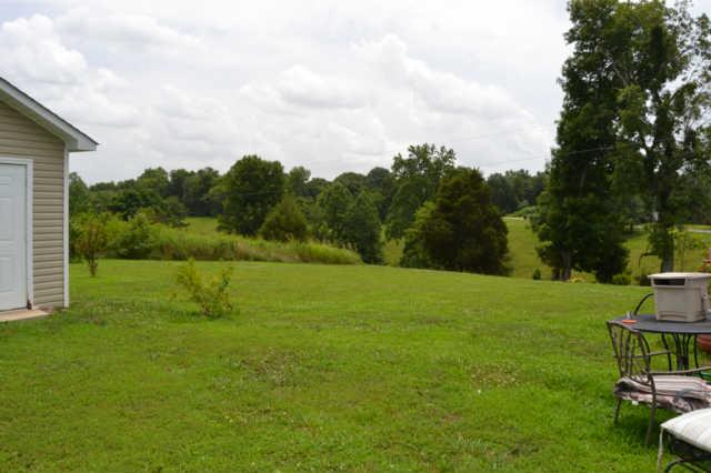 2580 Black Road Prospect, TN 38477 - Photo 4 of 7 a view of a garden with a house