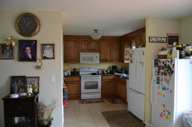 2580 Black Road Prospect, TN 38477 - Photo 5 of 7 a kitchen with stainless steel appliances granite countertop a refrigerator and a stove top oven