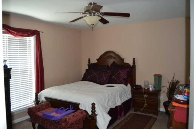 2580 Black Road Prospect, TN 38477 - Photo 7 of 7 a bedroom with a bed and a chandelier