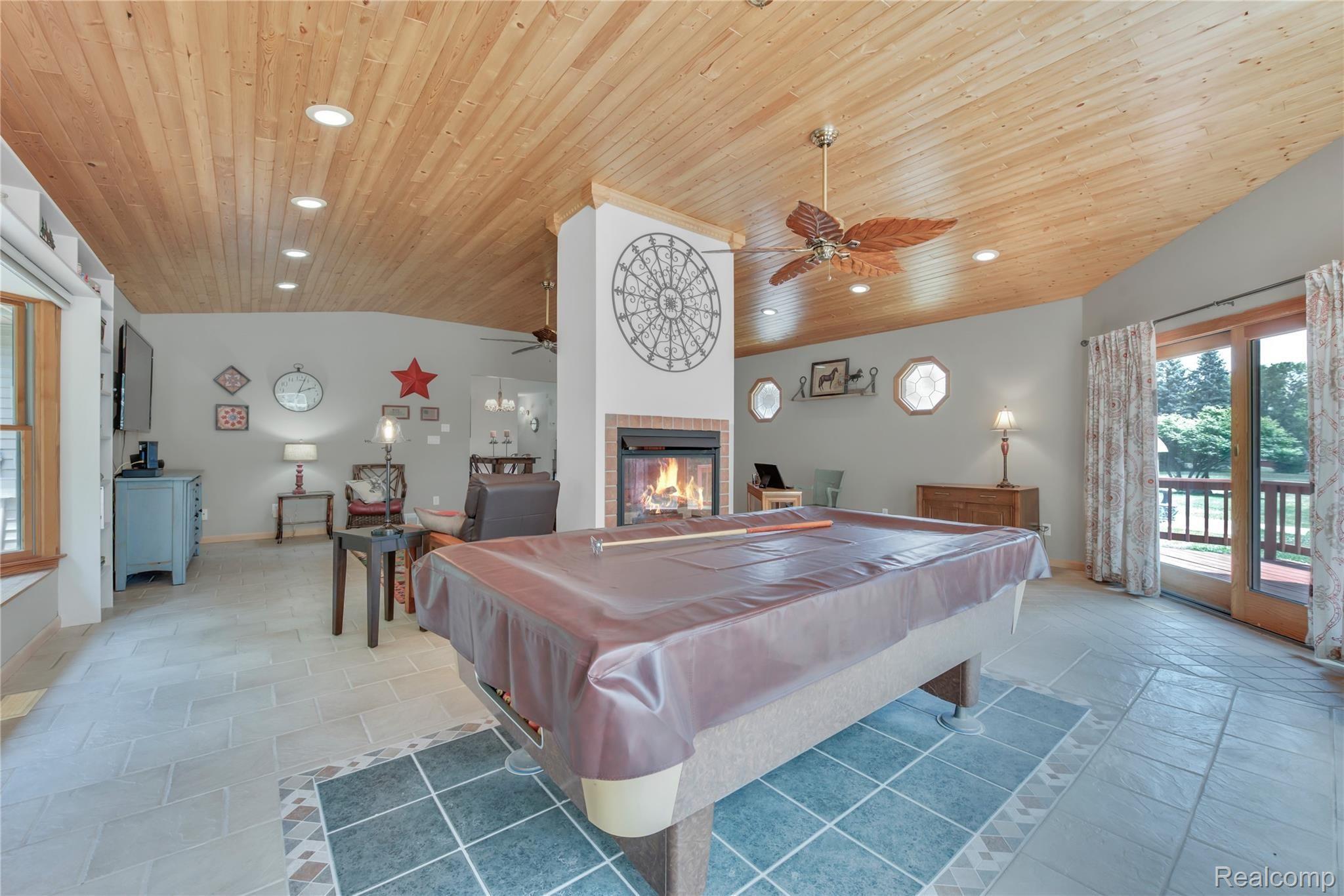 4110 Curtis Road Leonard, MI 48367 - Photo 20 of 46 entertaining paradise in great room with sliding doors to private deck!
