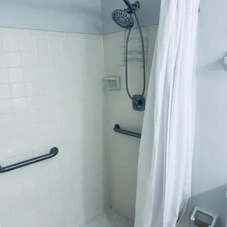 a bathroom with a toilet and shower