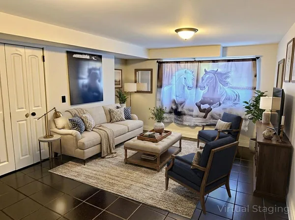 a living room with furniture and wooden floor