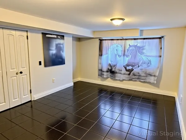 a view of a room with wooden floor and cabinet
