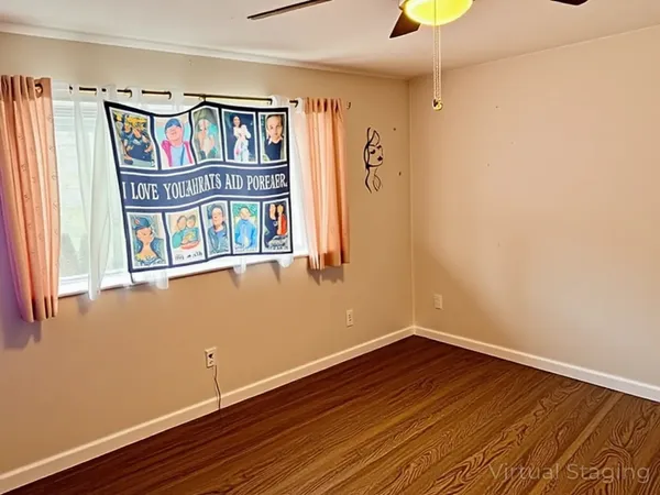a view of an entryway with wooden floor