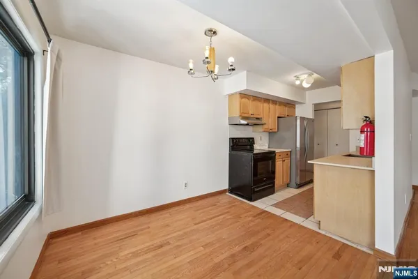 a view of a kitchen with wooden floor
